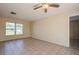 Living room with tile floors and large windows at 7353 Knoll Dr, New Port Richey, FL 34653