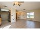 Bright living room with tile floors and access to kitchen at 7353 Knoll Dr, New Port Richey, FL 34653