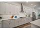 Beautiful kitchen with stainless steel appliances, white countertops, and view to the dining and living spaces at 7432 Paradiso Dr, Apollo Beach, FL 33572