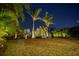 A variety of palms illuminate this professionally landscaped yard at 7432 Paradiso Dr, Apollo Beach, FL 33572