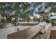 Picturesque town square featuring outdoor seating, lush trees with string lights and centerpiece water fountain at 800 S Dakota Ave # 205, Tampa, FL 33606