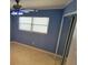 Bedroom with blue walls, tile flooring and natural light at 904 W Braddock St, Tampa, FL 33603