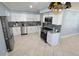 Bright kitchen featuring white cabinets, stainless steel appliances, and granite countertops at 904 W Braddock St, Tampa, FL 33603