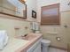 Bathroom featuring a sleek vanity, modern fixtures, and ample counter space at 9838 53Rd N Ave, St Petersburg, FL 33708