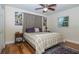 Comfortable bedroom with soft lighting, neutral colors, and stylish bedding at 9838 53Rd N Ave, St Petersburg, FL 33708