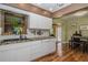 Modern kitchen featuring white cabinets, stainless steel appliances, and an open layout at 9838 53Rd N Ave, St Petersburg, FL 33708