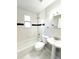 Clean bathroom with a bathtub and shower combination and classic fixtures at 101 W Fern St, Tampa, FL 33604