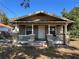 Charming bungalow with a porch and columns, plus neat landscaping and a well-maintained front yard at 101 W Fern St, Tampa, FL 33604