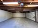 This is a standard unfinished garage with a concrete floor, exposed rafters and a garage door at 101 W Fern St, Tampa, FL 33604