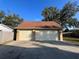 Two-car garage with a red roof is a great addition to the backyard at 101 W Fern St, Tampa, FL 33604