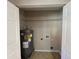 Practical utility closet with water heater and laundry hookups at 101 W Fern St, Tampa, FL 33604