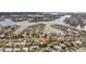 Stunning aerial shot of a waterfront neighborhood, showcasing canals and gorgeous surrounding scenery at 10100 Paradise Blvd, Treasure Island, FL 33706