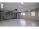 Spacious garage featuring a finished floor and well-lit interior at 10100 Paradise Blvd, Treasure Island, FL 33706