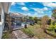 Backyard showcasing a lattice-covered patio leading to a pool and lounge chairs at 1035 County Road 90, Palm Harbor, FL 34684