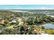 Aerial view of the neighborhood featuring lake access and views of the bridge in the distance at 10562 99Th St, Largo, FL 33773