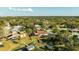 Aerial view of homes in a lush residential neighborhood, some homes with private docks at 10562 99Th St, Largo, FL 33773