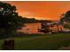 Picturesque waterfront view at sunset with lush greenery and private dock at 10562 99Th St, Largo, FL 33773