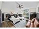 Bright bedroom featuring twin beds, a ceiling fan, and ample natural light from the large window at 10562 99Th St, Largo, FL 33773