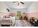 Charming bedroom featuring a horse theme, decorative rug, and ample natural light at 10562 99Th St, Largo, FL 33773