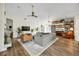 Cozy living room with wood floors and a built-in bookshelf at 10562 99Th St, Largo, FL 33773