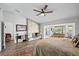 Bedroom featuring fireplace, bay window, and a desk area at 10562 99Th St, Largo, FL 33773