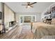 Comfortable bedroom with bay window and stone fireplace feature at 10562 99Th St, Largo, FL 33773