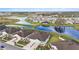 Community aerial view showcasing beautiful waterways, lush landscapes, and desirable homes at 10646 Pepper Dawn Cir, San Antonio, FL 33576