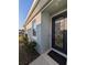 Modern front door with decorative glass, complemented by neat landscaping at 10646 Pepper Dawn Cir, San Antonio, FL 33576