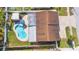 Aerial view of the home showcasing the pool, shed, roof, and backyard at 10829 65Th N Way, Pinellas Park, FL 33782