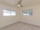 Bedroom featuring tile floors, ceiling fan, and windows that provide natural light at 10829 65Th N Way, Pinellas Park, FL 33782