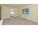 Bright living area with tile floors, large windows, and access to the outdoors at 10829 65Th N Way, Pinellas Park, FL 33782