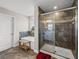 Bright bathroom featuring a soaking tub, glass shower, and neutral color palette at 11333 June Briar Loop, San Antonio, FL 33576