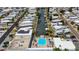 Aerial view of waterfront community with canal access, pool, and solar panels at 114 W Saint Johns Way, Apollo Beach, FL 33572