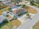 An aerial view of a well-maintained single Gathering home with a long driveway and fenced in yard at 1211 Carolyn Ln, Clearwater, FL 33755