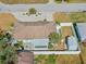 Aerial view of a single Gathering home with a fenced in yard and shed at 1211 Carolyn Ln, Clearwater, FL 33755