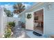 Bathroom exterior featuring an outdoor shower, privacy fence and tiled patio at 1211 Carolyn Ln, Clearwater, FL 33755