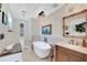 Bathroom with freestanding tub, elegant fixtures, and detailed mirror at 1211 Carolyn Ln, Clearwater, FL 33755