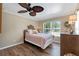 Bright bedroom with wood floors, large window and neutral colored walls at 1211 Carolyn Ln, Clearwater, FL 33755