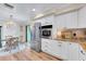 Kitchen and dining area features stainless steel appliances and lots of storage space at 1211 Carolyn Ln, Clearwater, FL 33755