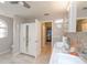 This bathroom features double sinks, a closet, and tile flooring at 12478 93Rd Way, Largo, FL 33773