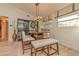 This dining area has a built-in shelving unit, a modern light fixture and bright, natural light at 12478 93Rd Way, Largo, FL 33773