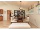 This dining area features a dark wood table, bench seating and modern shelving at 12478 93Rd Way, Largo, FL 33773