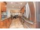 Well-lit kitchen with stainless steel appliances and granite countertops at 12478 93Rd Way, Largo, FL 33773