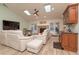 Sun-filled living room with skylights, fireplace, bar and direct access to the backyard pool at 12478 93Rd Way, Largo, FL 33773