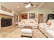 Cozy living room featuring a fireplace, skylights, and modern white furniture at 12478 93Rd Way, Largo, FL 33773