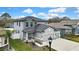 Exterior angle of a home, showcasing a large driveway and attached three-car garage at 12704 Vander Way, New Port Richey, FL 34654