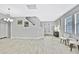 Bright foyer featuring wood-look tile flooring, and stairway to the second floor at 12704 Vander Way, New Port Richey, FL 34654