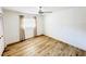 Bedroom featuring wood-look floors, neutral walls, and a ceiling fan at 13290 75Th Ave, Seminole, FL 33776