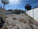 Backyard with a stone garden in center of the fenced yard at 13331 1St E St, Madeira Beach, FL 33708