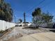 Backyard with garden area surrounded by white vinyl fencing for privacy at 13331 1St E St, Madeira Beach, FL 33708